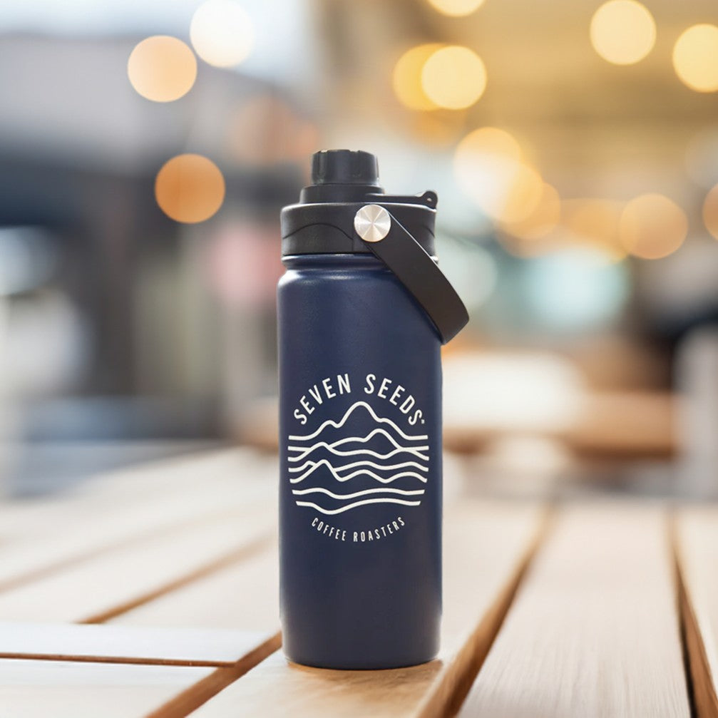 blue custom water bottle on a table